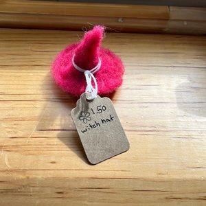 Small felted witch hat which broomstick and small bat